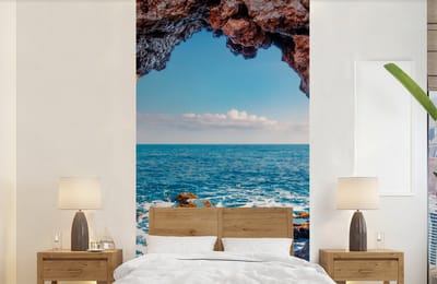 Behang - Fotobehang Grot - Zee - Rotsen - Natuur - Breedte 120 cm x hoogte 240 cm