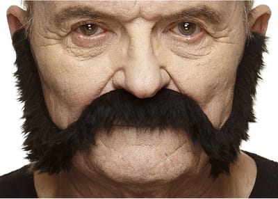 Partychimp Lange Nep Snor Zelfklevend Plaksnor voor Carnaval Verkleedaccessoire - Zwart - Imitatiebont