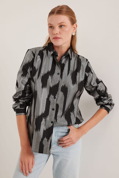 Oversized gestreepte blouse met knopen