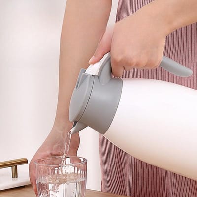Fabrikanten van huishoudelijke thermosflessen Grote capaciteit Koperen binnenvoering Thermische isolatie Warmwaterglas thermosfles 1300ml roze
