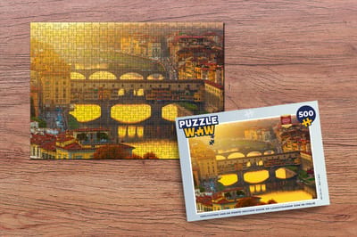 Puzzel Verlichting van de Ponte Vecchio door de laagstaande zon in Italië - Legpuzzel - Puzzel 500 stukjes