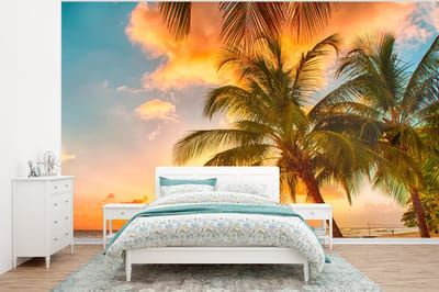 Behang - Fotobehang Zonsondergang - Palmboom - Wolken - Zee - Strand - Breedte 400 cm x hoogte 300 cm