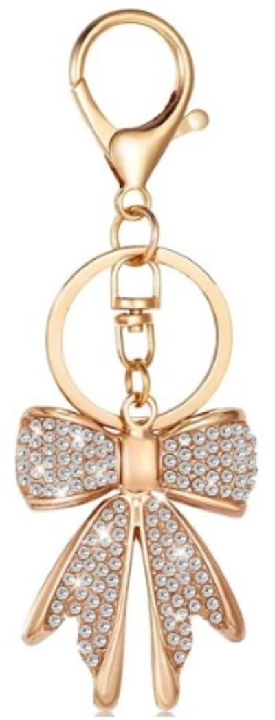 Bagcharm - sleutelhanger - tashanger - charm - bedel - strik met steentjes - goud kleur met witte steentjes - bow - cadeau