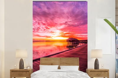 Behang - Fotobehang Steiger - Water - Zon - Roze - Horizon - Breedte 145 cm x hoogte 220 cm