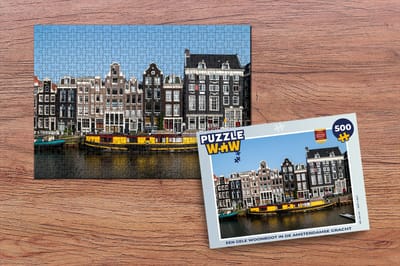 Puzzel Een gele woonboot in de Amsterdamse gracht - Legpuzzel - Puzzel 500 stukjes