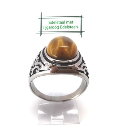 Edelstaal ovale zegelring met Tijgeroog edelsteen maat 22. Mooie bewerkt zijkant zwart met stoer motief coating bieden de geweldige touch sensatie en stoer en charmant uit, deze ring is prachtig als cadeau of zelf te verwennen.