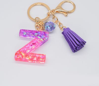 Letter Sleutelhanger A-Z – Luxe Initialen Sleutelhanger met Pompon & Kwastje – Tashanger voor Dames & Meisjes – Accessoire voor Sleutelbos, Handtas, Rugzak & Autosleutel – Persoonlijk Cadeau voor Vrouw, Moeder, Dochter & Vriendin