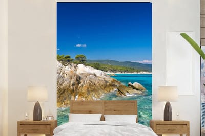 Behang - Fotobehang Zee - Klif - Zomer - Tropisch - Breedte 195 cm x hoogte 300 cm