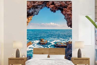 Behang - Fotobehang Grot - Zee - Rotsen - Natuur - Breedte 180 cm x hoogte 280 cm