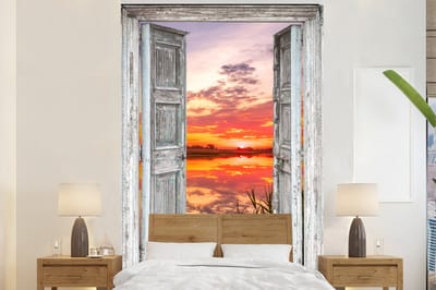 Behang - Fotobehang Landschap - Zonsondergang - Water - Doorkijk - Breedte 200 cm x hoogte 300 cm