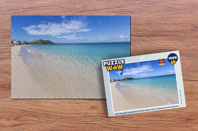 Puzzel Het heldere zeewater spoelt aan op het strand bij Sint Maarten - Legpuzzel - Puzzel 1000 stukjes volwassenen