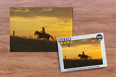 Puzzel Een cowboy onder een oranje hemel - Legpuzzel - Puzzel 500 stukjes