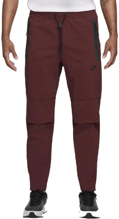Nike tech fleece woven pants in de kleur rood.