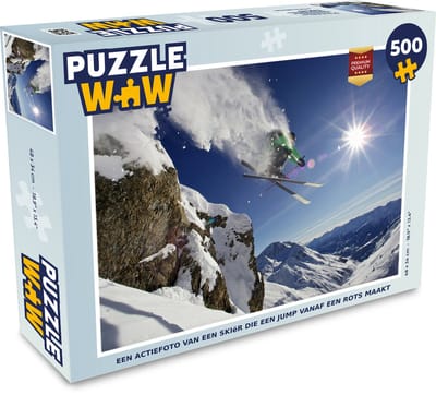 Puzzel Een actiefoto van een skiër die een jump vanaf een rots maakt - Legpuzzel - Puzzel 500 stukjes