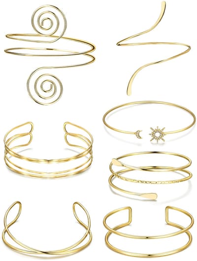 Dailygoods- Bovenarmbanden 7-delige set - Gouden Armbanden - Minimalistisch Ontwerp - Zon/Maan/Swirl/Spiraal - Comfortabele Draagervaring - Verstelbaar en Hoogwaardige Materialen