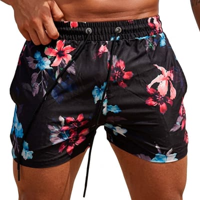 Zwart zwembroek heren met bloemen print, elastische tailleband met trekkoord, korte zwemshort met rode blauwe en witte bloemen, all over bloemenpatroon maat M