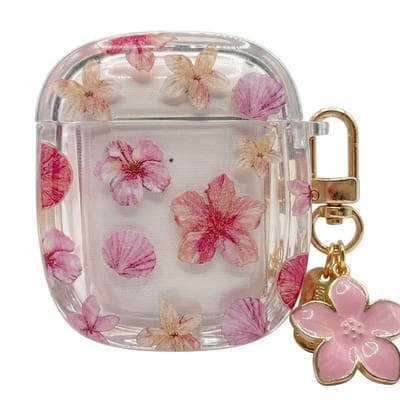 Transparant roze hoesje voor oordopjes dames met bloemen patroon en decoratieve hanger geschikt voor AirPods 4 met ronde vorm en goudkleurige clip