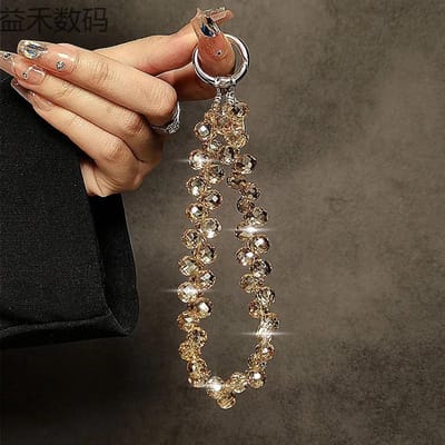 Lanière de téléphone portable clignotante Chaîne de suspension courte de luxe haut de gamme Chaîne de poignet à perles faites à la main Pendentif à tenir dans la main couleur champagne