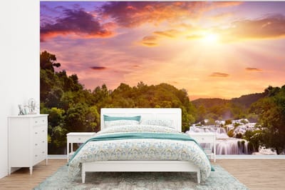 Behang - Fotobehang Waterval - Landschap - Zon - Wolken - Zonsondergang - Breedte 295 cm x hoogte 220 cm