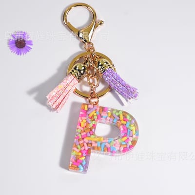 Sleutelhangers of voor je tas van A tot Z - met een pompon of kwastje - met letter - mooi design - handgemaakt - sleutelhangers - design - mode - goud - zwart - blauw - roze- rood