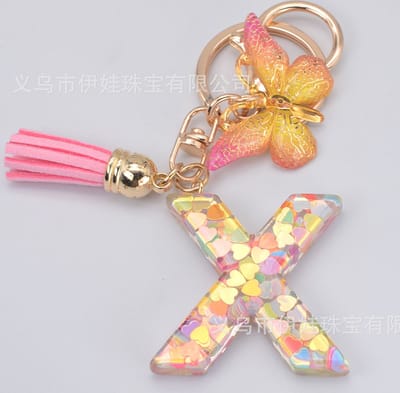 Sleutelhangers of voor je tas van A tot Z - met een pompon of kwastje - met letter - mooi design - handgemaakt - sleutelhangers - design - mode - goud - zwart - blauw - roze- rood