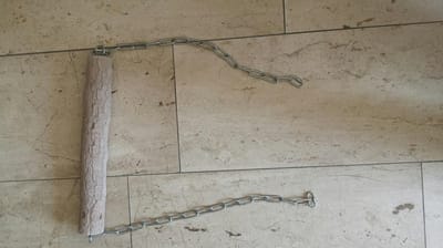 Slijtstokschommel met kettingen