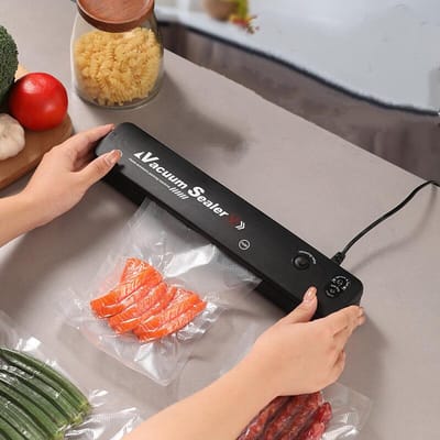 Vacumeermachine - Vacuümverpakkingsmachine– Compact ontwerp -Automatische werking - Uiterst stil en snel (verpakking in 15 seconden) - Inclusief 30vacuümzakken – Zwart vacuümsysteem voor alle soorten voedsel