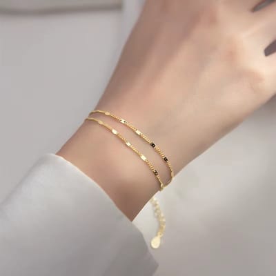 Dames Armband - Elegant Dubbel‑Laags Damesarmband – Goudkleurig - Roestvrij Staal, Luxe & Tijdloos