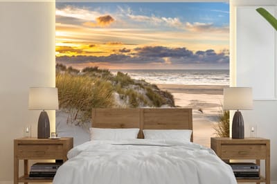 Behang - Fotobehang Strand - Duin - Gras - Zonsondergang - Zee - Breedte 300 cm x hoogte 300 cm