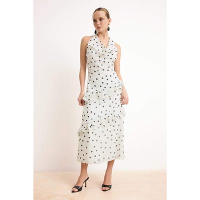 Mouwloze midi-jurk met stippen voor dames, geschikt voor overdag en 's avonds.