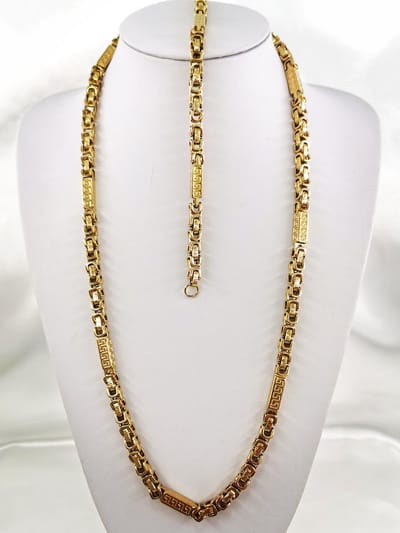 Set: - RVS - Heren - Koningsschakel - goudkleurig - design - ketting - L 70 cm - Armband L 22 cm - Br 6 mm.