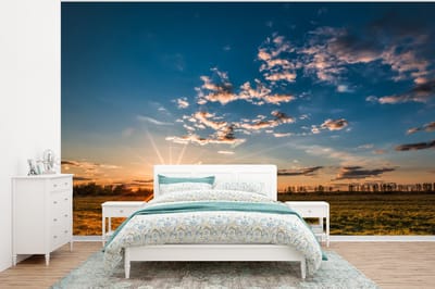 Behang - Fotobehang Zonsondergang - Natuur - Wolken - Gras - Breedte 375 cm x hoogte 280 cm