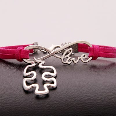 GoedeDoelen.Shop | Veterarmband Autisme Love Infinity Roze | Autisme Sieraad | Autisme Awareness | Infinity Sieraad | Statement Armband | Polsmaat 18 + 5 cm | Wellness-House|