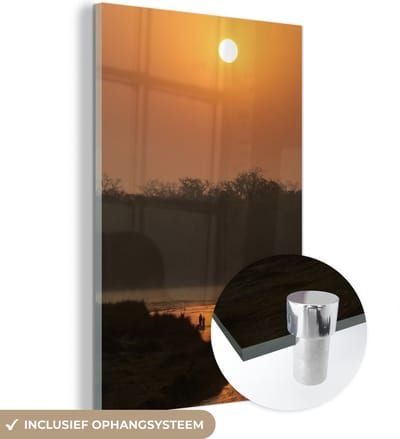® Glasschilderij 120x180 cm - Schilderij acrylglas - Oranje zonsondergang bij het Nationaal park Chitwan in Nepal - Foto op glas - Muurdecoratie woonkamer - Wanddecoratie slaapkamer - Schilderijen