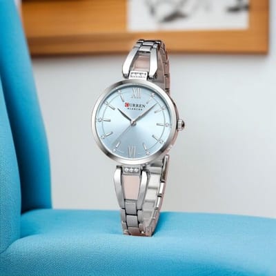 Luxe CURREN Dameshorloge Zilverkleur met lichtblauw wijzerplaat - Elegante Roestvrijstalen Horloge met Kristallen - Waterdicht & 5 Kleuren