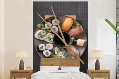 Behang - Fotobehang Bord vol met Japanse sushi - Breedte 200 cm x hoogte 300 cm