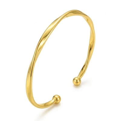 Goudkleurige open bangle armband voor dames met gedraaid design en bolvormige uiteinden – minimalistische dames armband