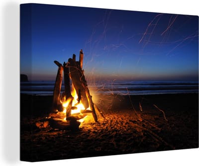 Canvas Schilderij Kampvuur op het strand - 120x80 cm - Wanddecoratie