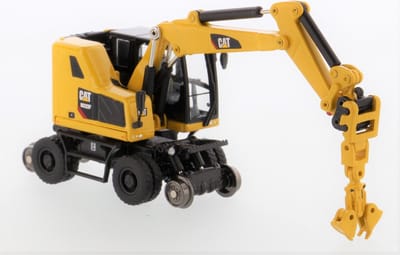 Diecast Masters - Cat M323F WHEX Graafmachine voor spoorweg werkzaamheden - 1:87 - HO Series