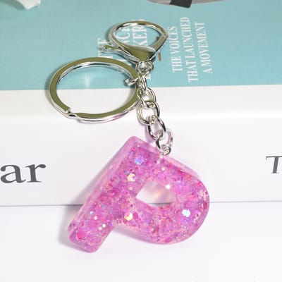 Sleutelhangers of voor je tas van A tot Z - met een pompon of kwastje - met letter - mooi design - handgemaakt - sleutelhangers - design - mode - goud - zwart - blauw - roze- rood