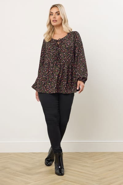 Yours Zwarte Peplum Top Met Bloemenstrik Aan De Voorkant Size 42