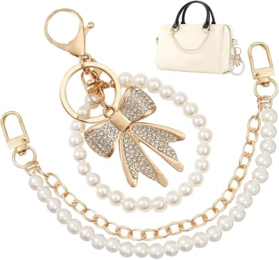 Tashangers - Set van 2 - Taskettingen - Verlengkettingen voor handtassen - Versierd met een witte strass strik - Geschikt voor schoudertassen en crossbodytassen - Handtasaccessoires - Eenvoudig te bevestigen - Verfraait de stijl van je tas - Goud