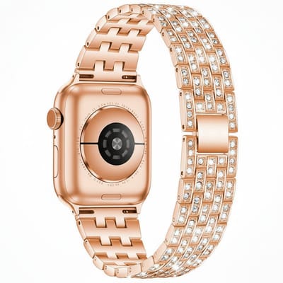 RVS bandje met glittersteentjes - geschikt voor Apple Watch 1/2/3/4/5/6/7/8/9/10/11/ SE (1,2,3) met maat 38 mm / 40 mm / 41 mm en 42 mm (Watch 10/11) - stalen band met kliksluiting - rosegoud