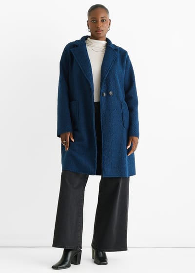 Marineblauw schapenvacht jasje met dubbele knoopsluiting en halflange mouwen