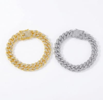 Set van 2 schakel armbanden voor heren – goudkleurig en zilverkleurig – met grove schakels en ingelegde glinstersteentjes – herenstijl – opvallend design
