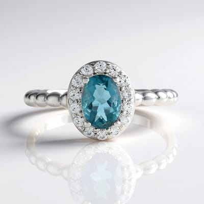 Cavill - Zilveren Ring met Ovale Petroleumkleur Fluoriet 0,97 ct en 14 Zirkonia 0,31 ct - 925 Sterling Zilver - Elegant en Tijdloos Sieraad