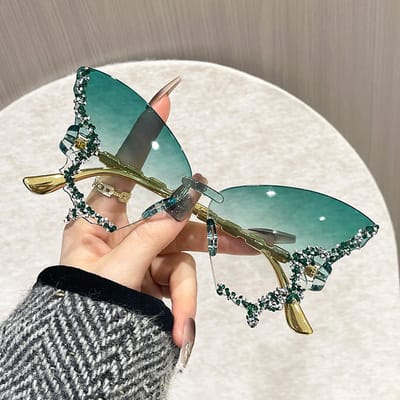 Retro klassieke dameszonnebril zonder montuur met vlinder- of diamantvormig design en UV-bescherming (groene lens)