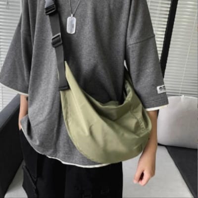 Schoudertas Nieuwe Stijl Street Fashion Rugzak met Grote Capaciteit Japanse Eenvoudige Dumplingtas Modieus Trendy Heren en Dames Crossbody Tas