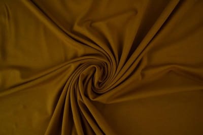 Katoen tricot stof - Donker okergeel - 10 meter