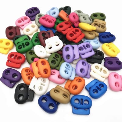Set van 50 Kleurige Rond Plastic Koordstopper met Dubbele Gaten voor Touwuiteinden, Ideaal voor Kamperen, Wandelen en Sporttassen vervangende Laces